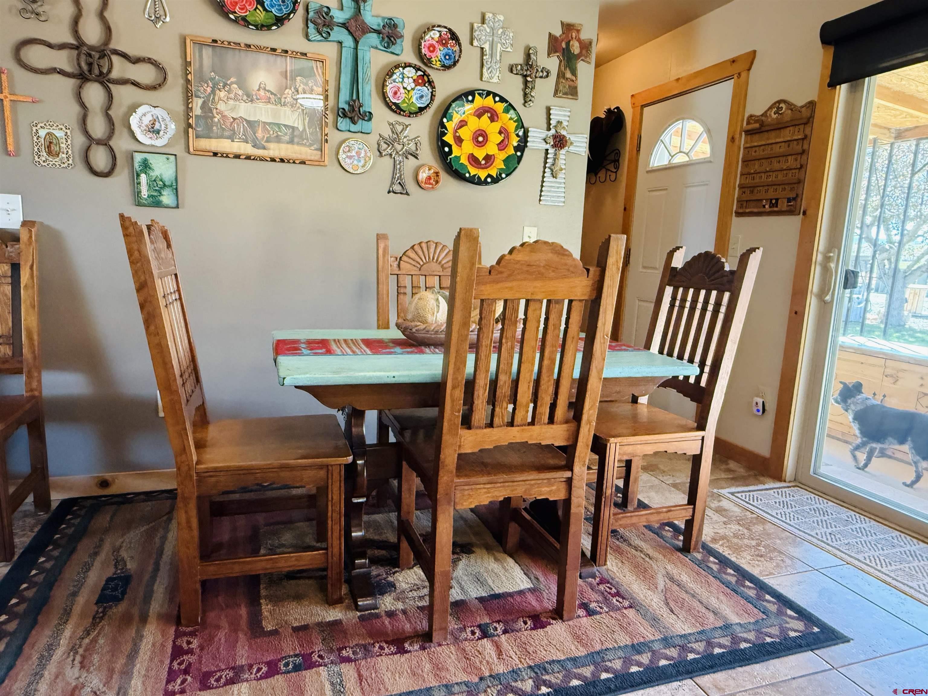 22680 E Road Delta, CO 81416 - Photo 17 of 31 a view of a dining room with furniture and a rug