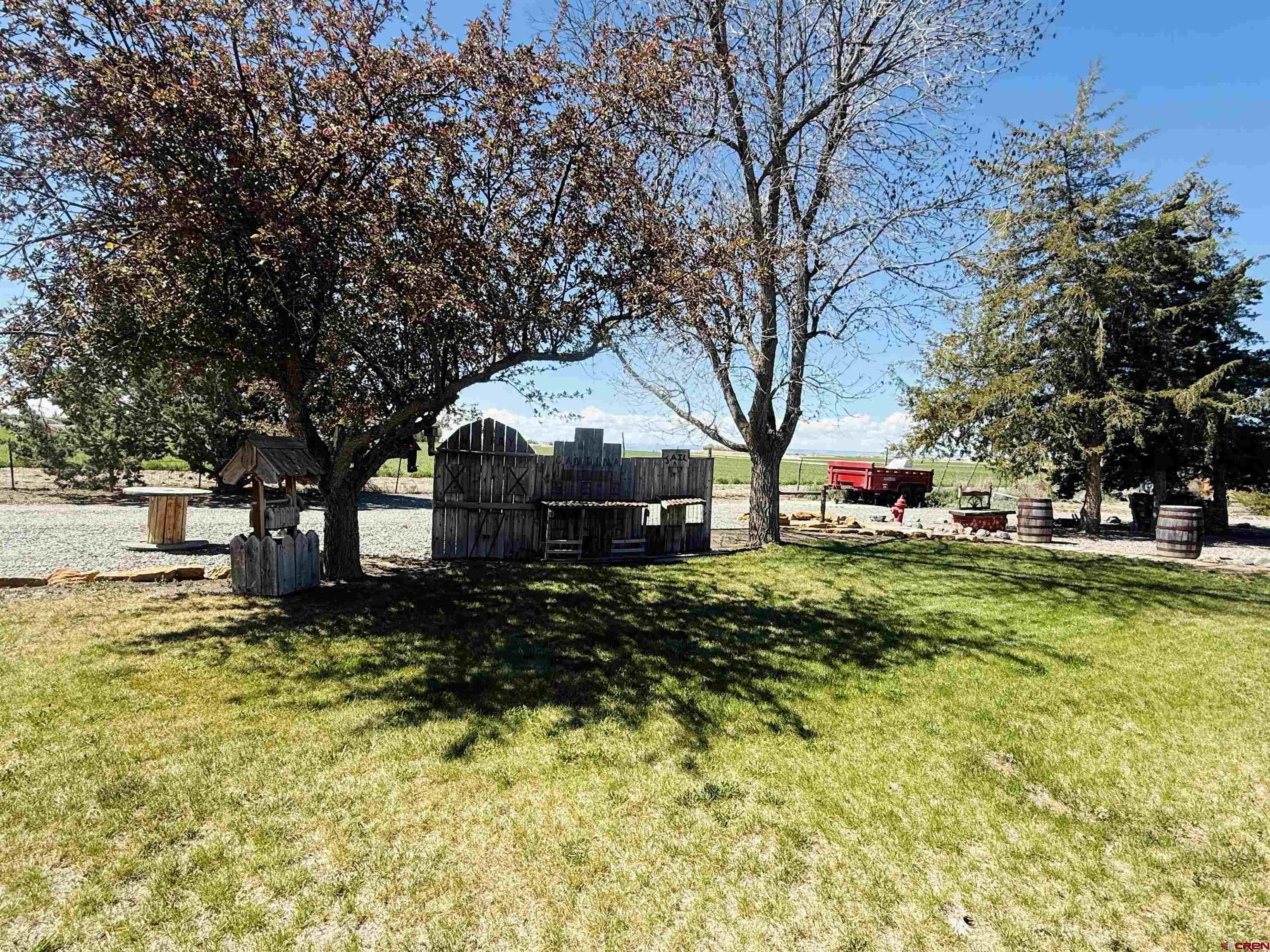 22680 E Road Delta, CO 81416 - Photo 20 of 31 a front view of house with yard and trees around