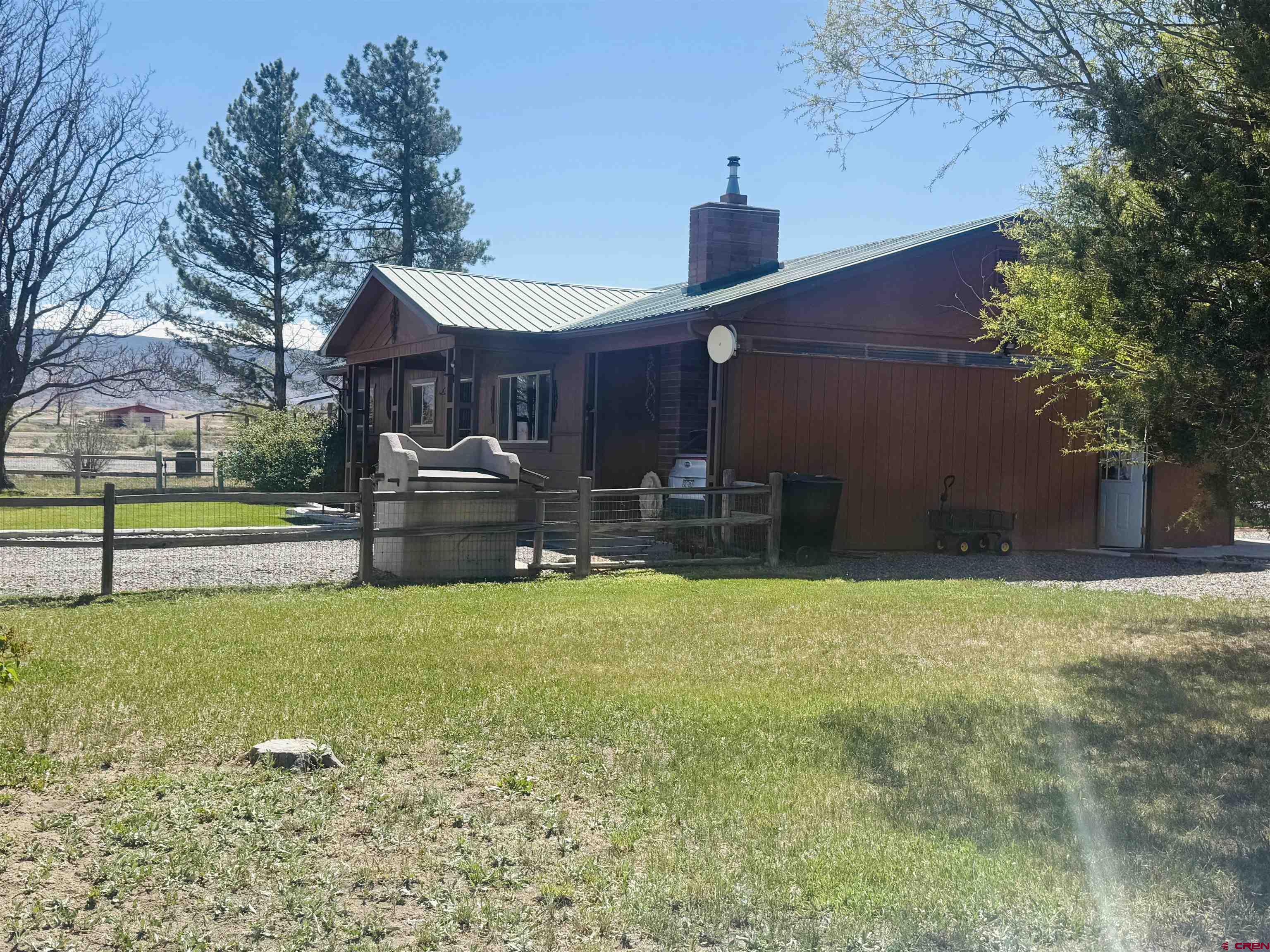 22680 E Road Delta, CO 81416 - Photo 2 of 31 a house view with swimming pool in front of it
