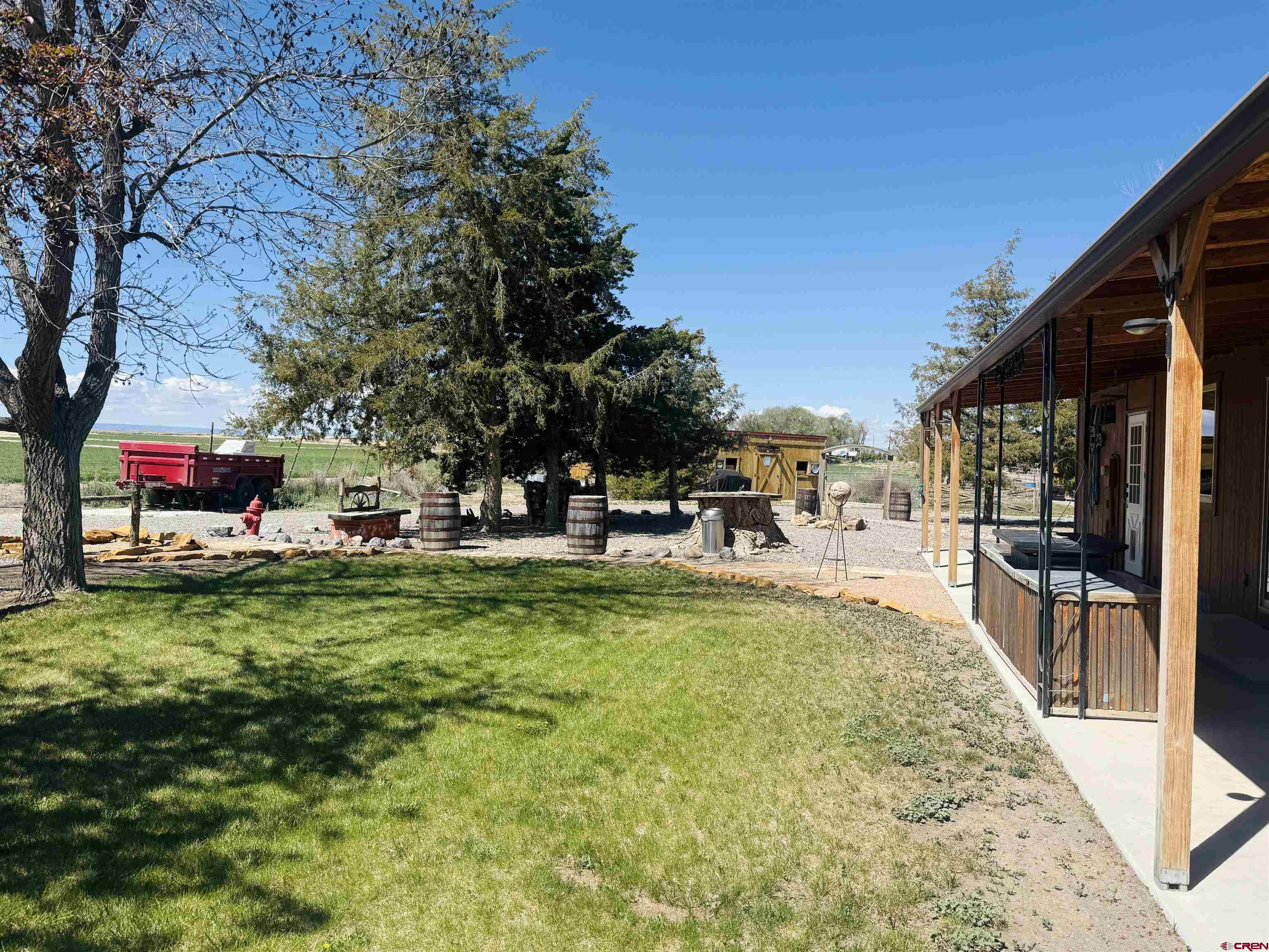 22680 E Road Delta, CO 81416 - Photo 27 of 31 a view of yard with swimming pool and sitting area