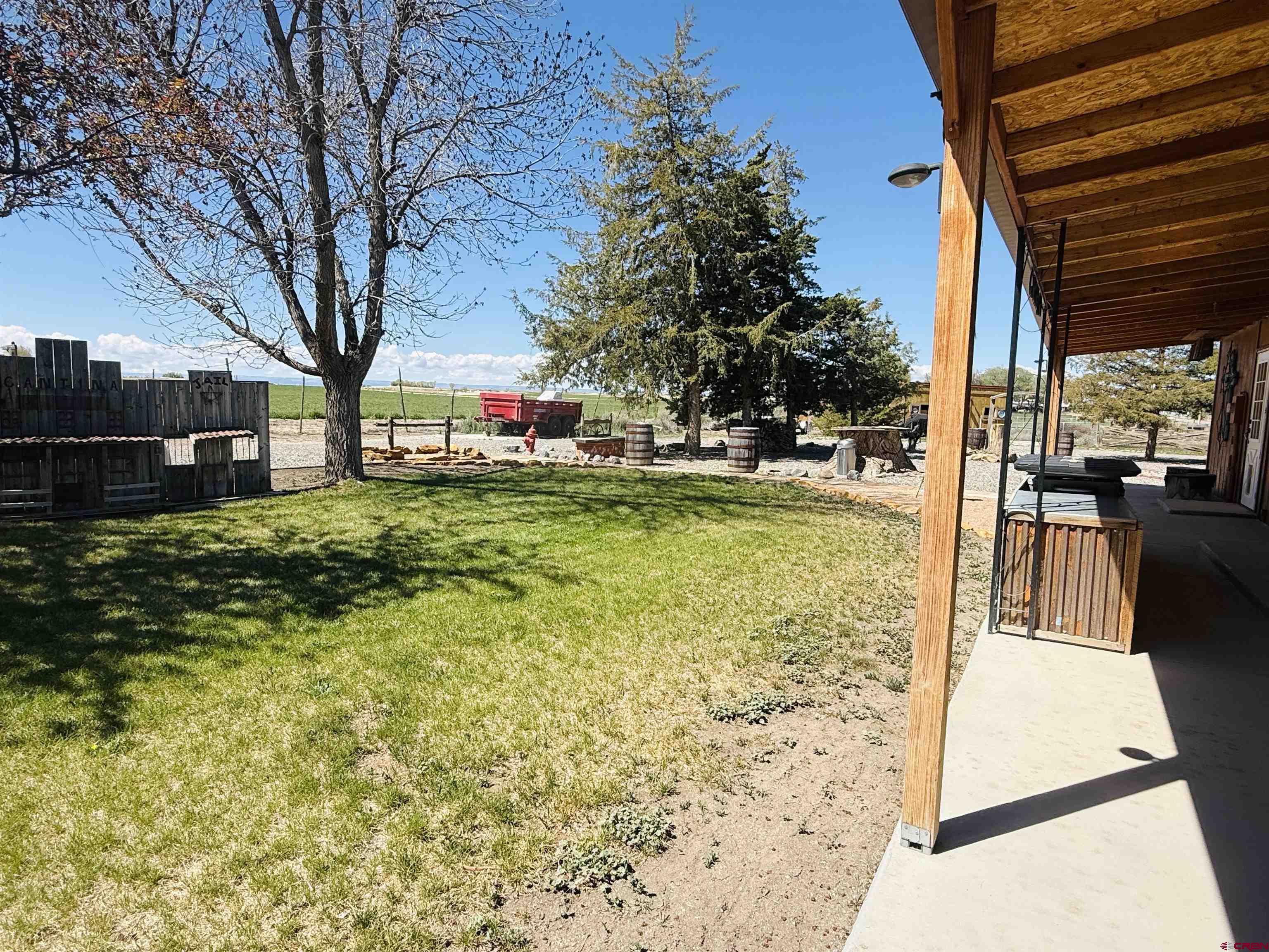 22680 E Road Delta, CO 81416 - Photo 8 of 31 a view of a patio with a yard