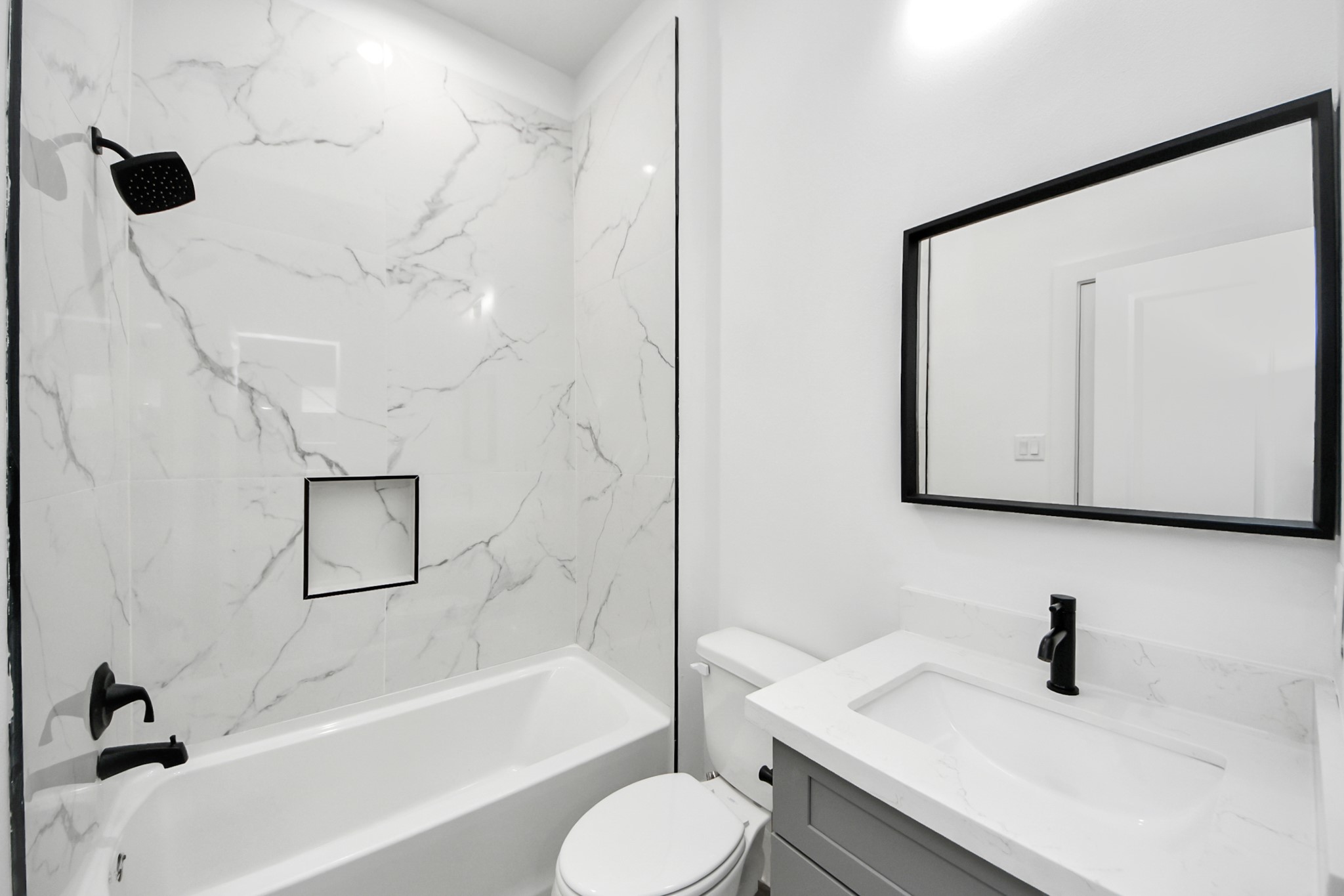 7412 Carver Road, Unit B Houston, TX 77088 - Photo 16 of 22 a bathroom with a sink toilet and shower