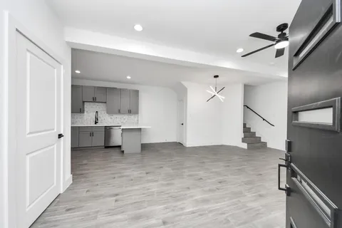 a view of a kitchen with a sink and a window