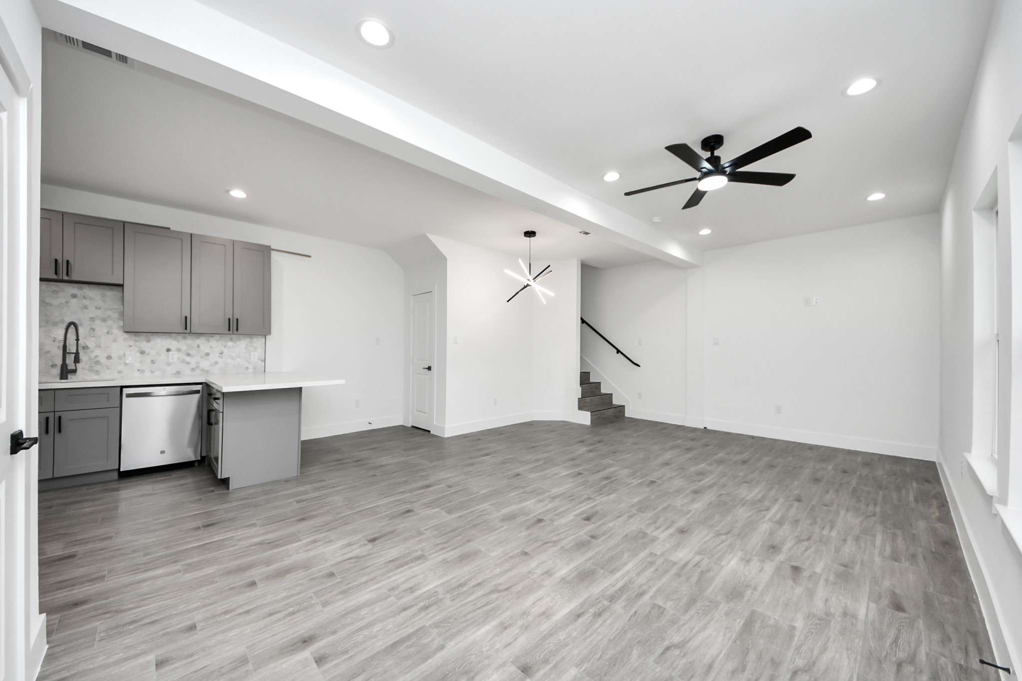 7412 Carver Road, Unit B Houston, TX 77088 - Photo 4 of 22 a view of a kitchen with a sink and a stove top oven