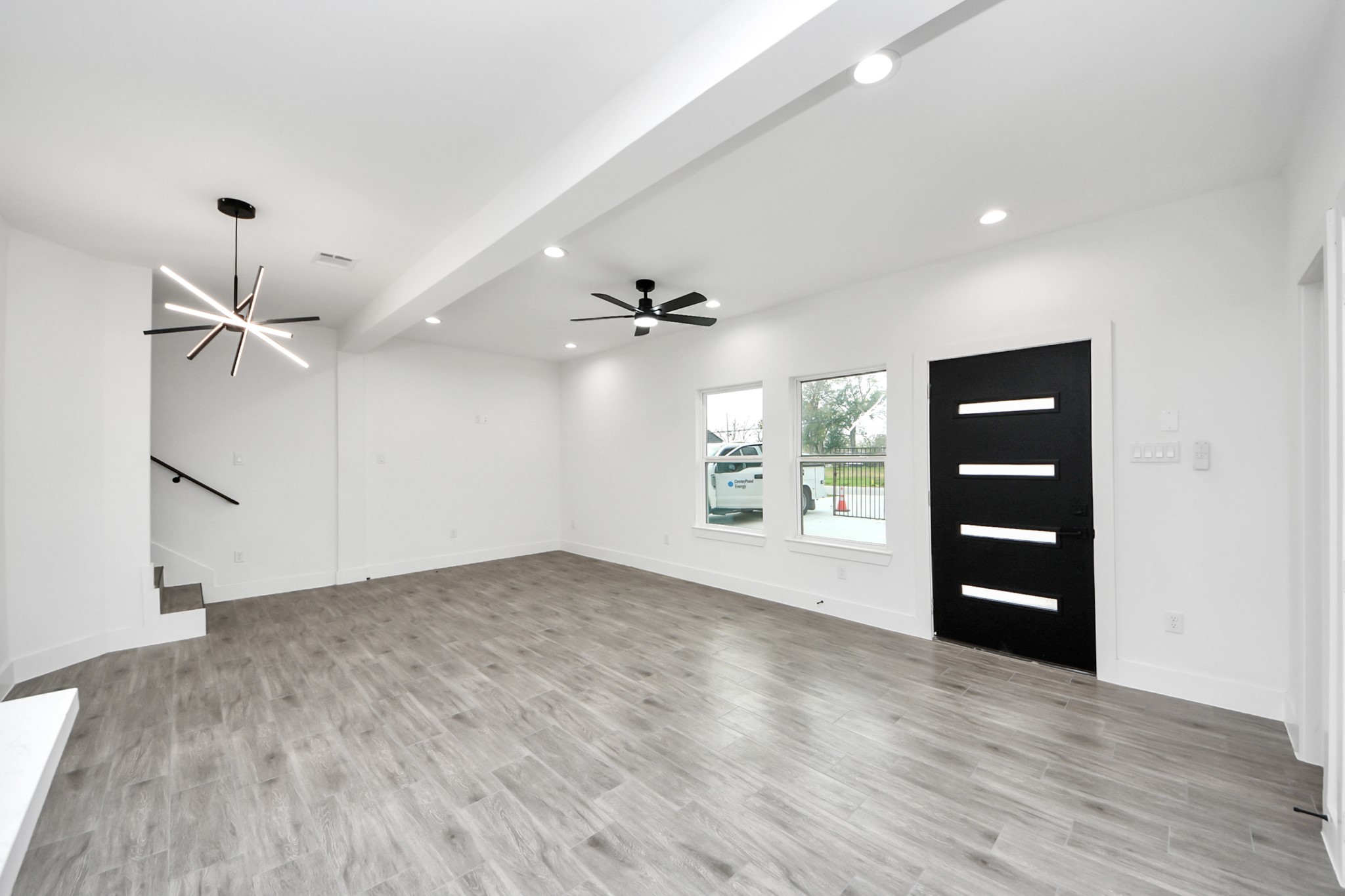 7412 Carver Road, Unit B Houston, TX 77088 - Photo 9 of 22 wooden floor in an empty room with a window
