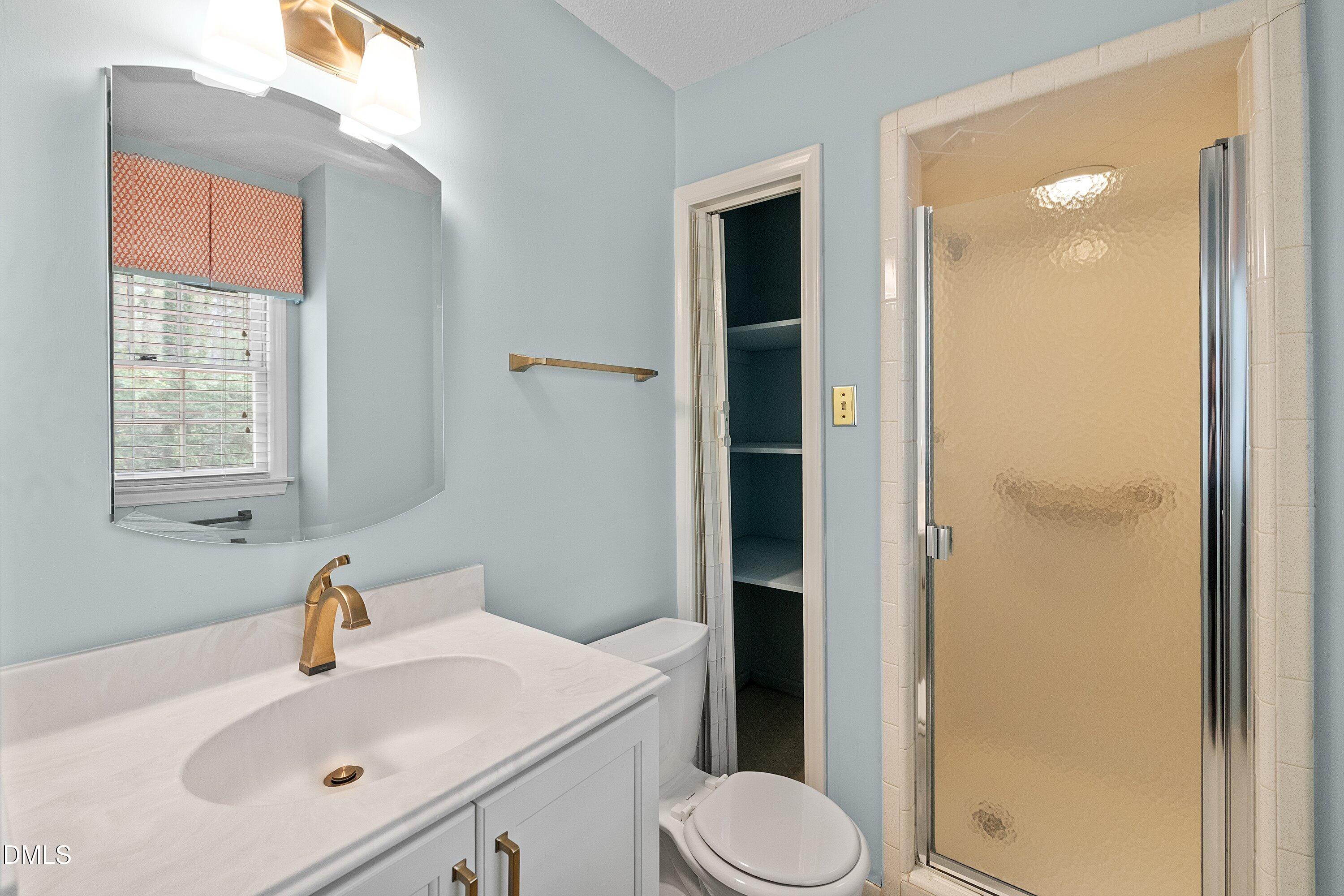 1429 Falls Church Road Raleigh, NC 27609 - Photo 43 of 60 a bathroom with a sink toilet and shower