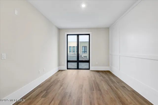 a bathroom with a tub sink shower and mirror