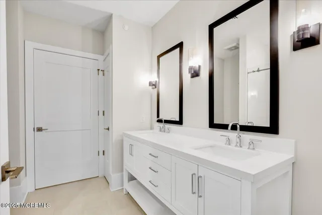 a bedroom with a bed table and window