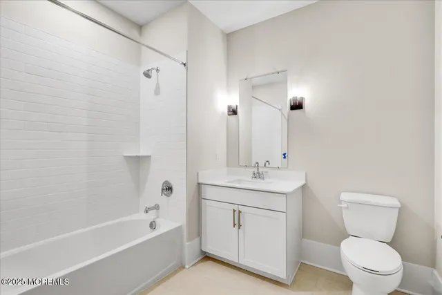 a living room with furniture and white walls