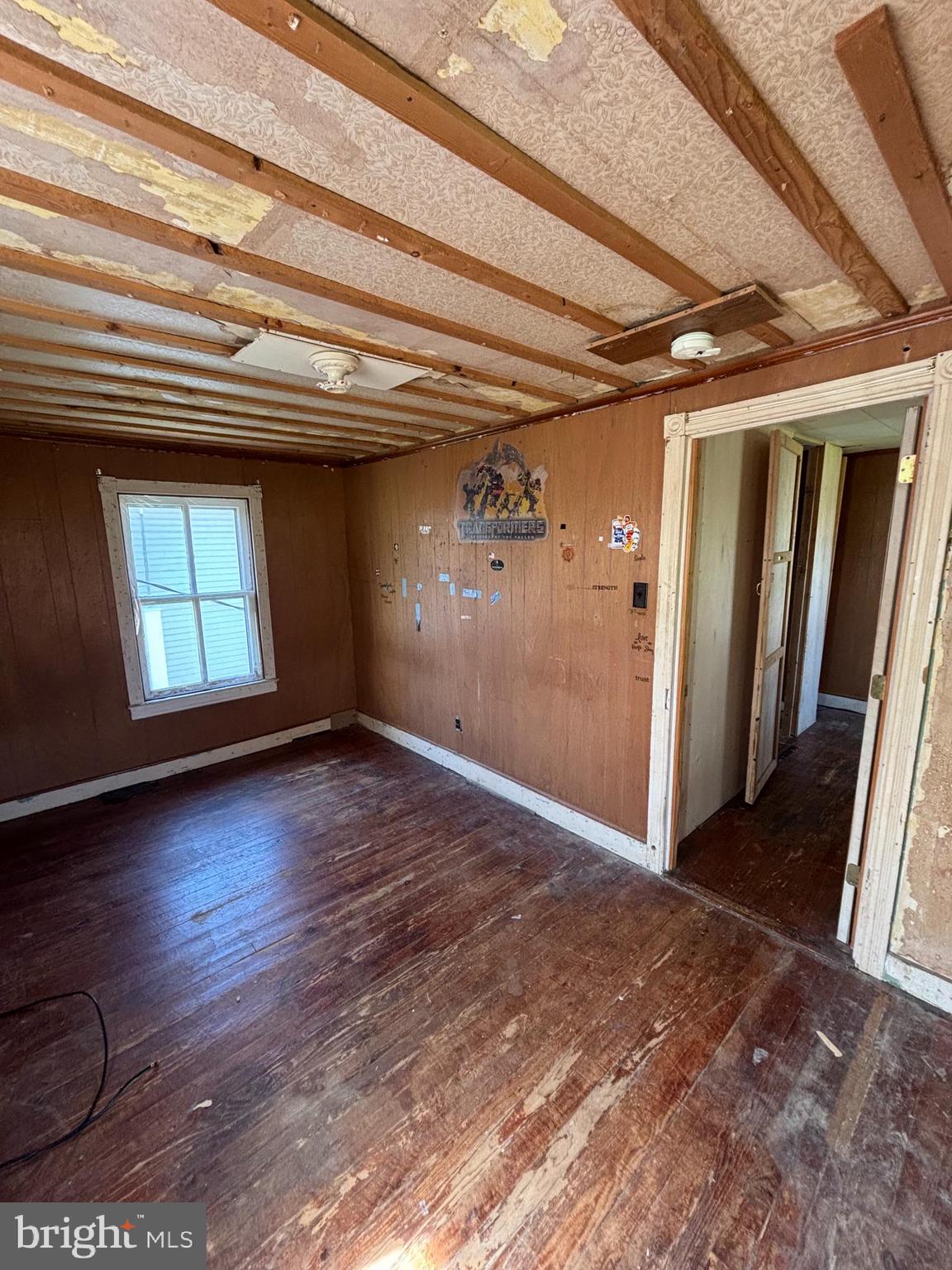 21447 East Sharp Street Rock Hall, MD 21661 - Photo 14 of 14 a view of empty room with wooden floor and fan