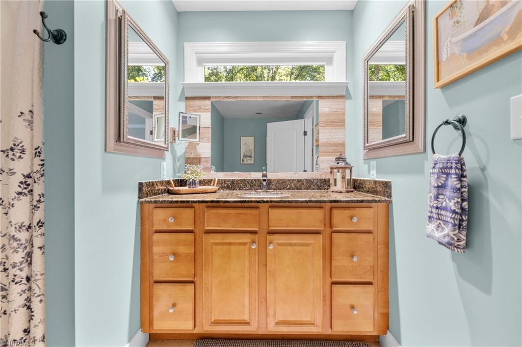 3930 Cole Avenue High Point, NC 27265 - Photo 19 of 44 En Suite tiled bath with granite, jetted tub, walk in shower.