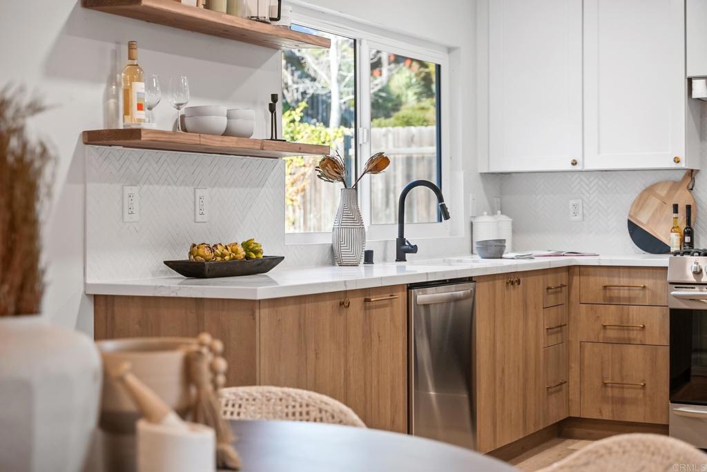 5898 Agee Street San Diego, CA 92122 - Photo 2 of 40 a kitchen with a sink and cabinets
