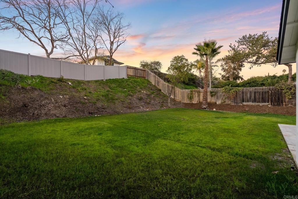 5898 Agee Street San Diego, CA 92122 - Photo 22 of 40 a view of a backyard with large trees