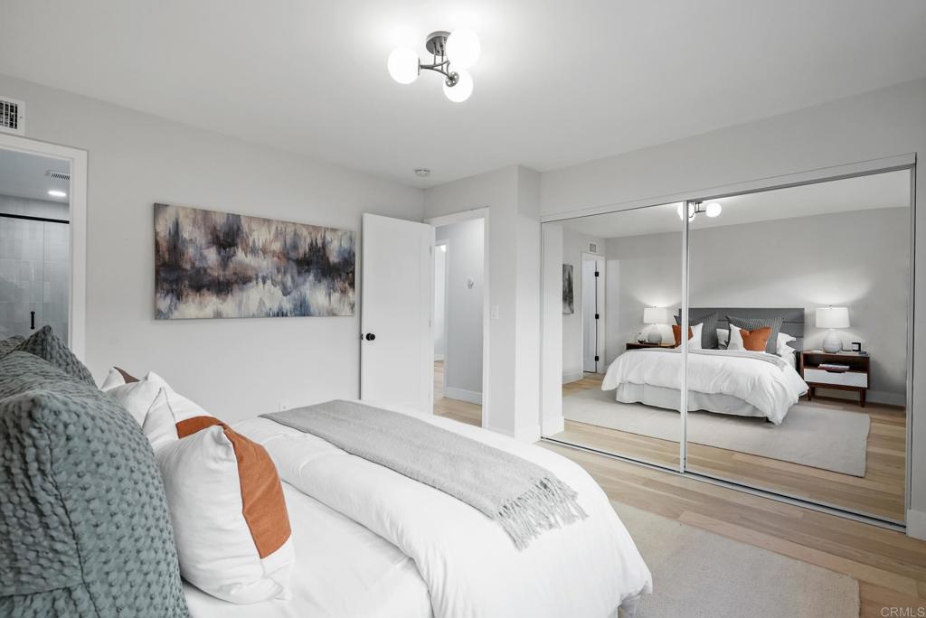 5898 Agee Street San Diego, CA 92122 - Photo 31 of 40 a bedroom with a bed and a painting on the wall