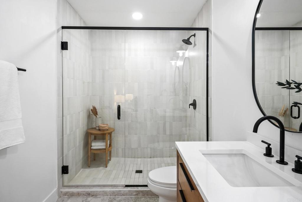 5898 Agee Street San Diego, CA 92122 - Photo 33 of 40 a bathroom with a sink a toilet and shower