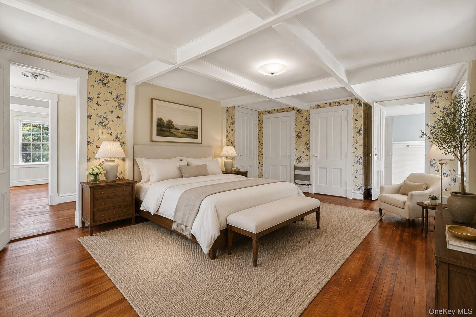433 Arcady Road Ossining, NY 10562 - Photo 13 of 21 a spacious bedroom with a bed a couch and wooden floor