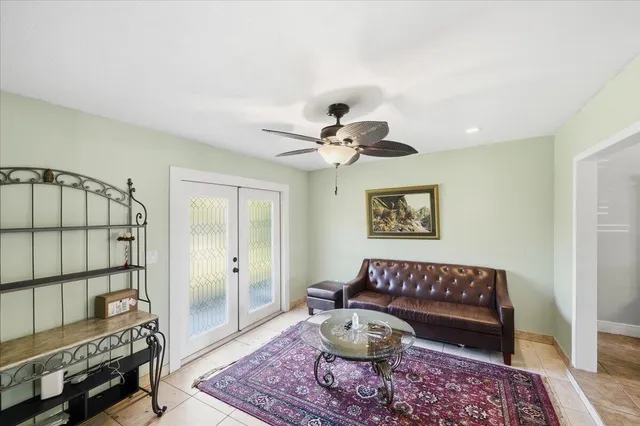 a living room with furniture and a rug