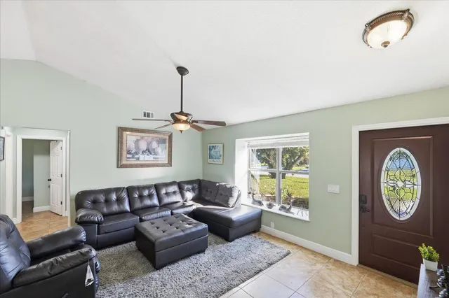 a living room with furniture and a window