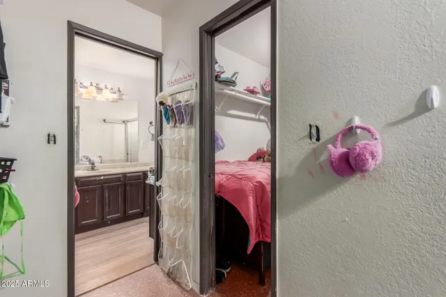 a bedroom with a bed and a bathroom