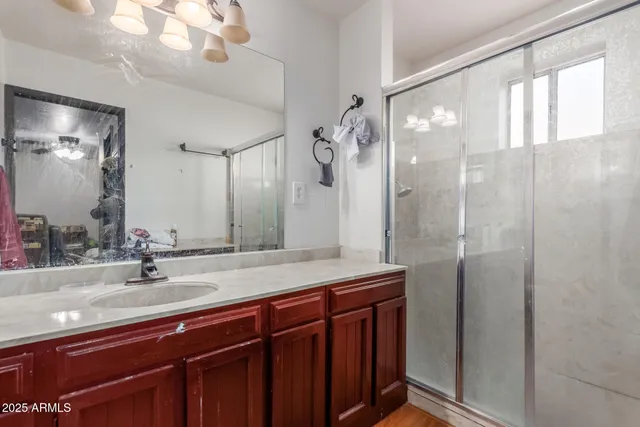 a bathroom with a sink double vanity and a mirror