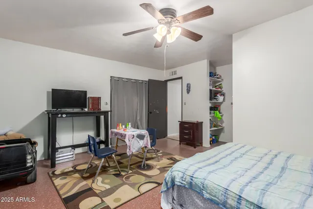 a bedroom with a bed and furniture