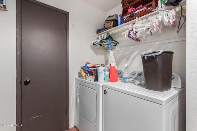 a kitchen with a refrigerator and cabinets