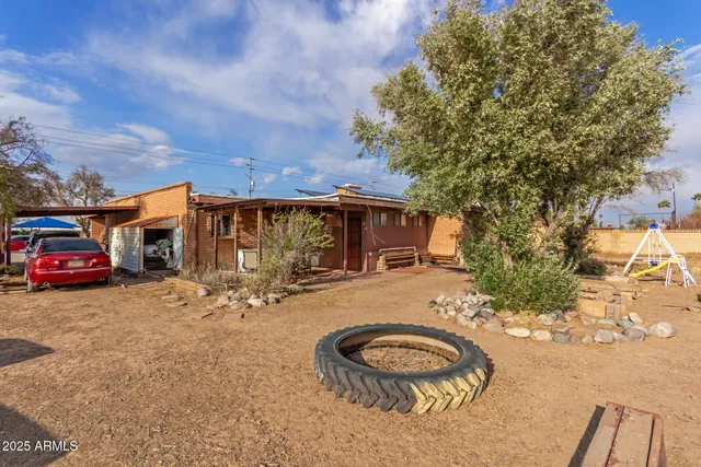 a view of a car park in front of a house