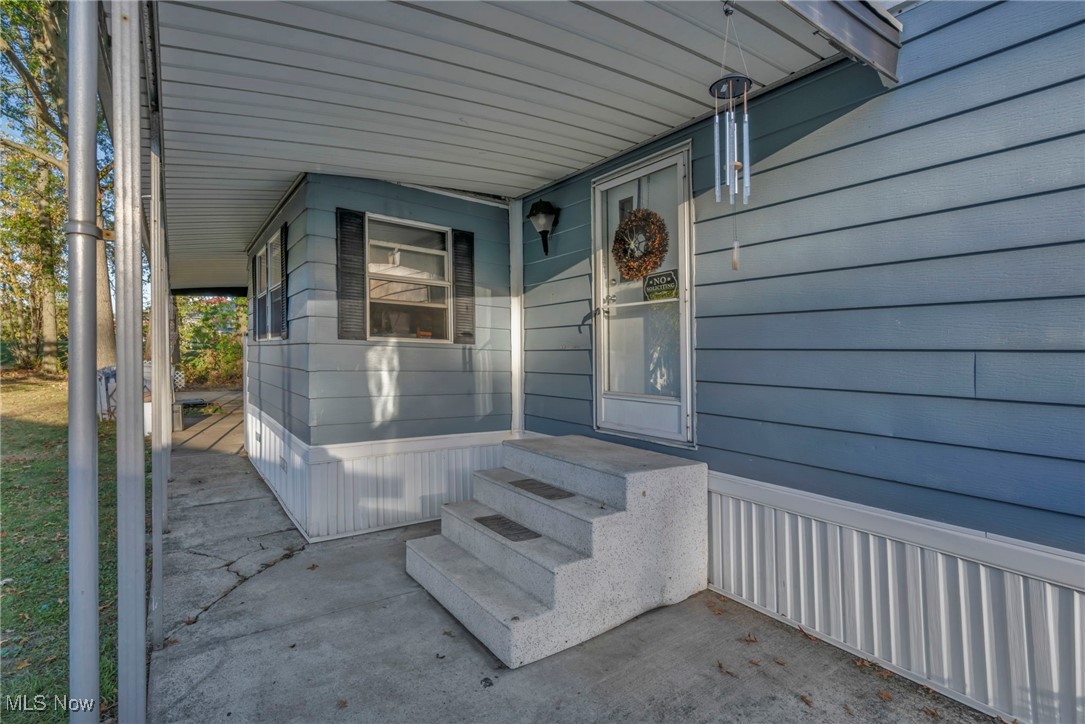 35157 Center Ridge Road, Unit 126 North Ridgeville, OH 44039 - Photo 5 of 50 Property entrance featuring a porch