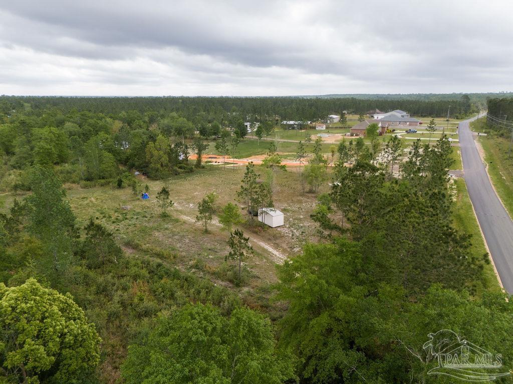 7706 Tidwell Road Pace, FL 32571 - Photo 23 of 25 a view of lake with city
