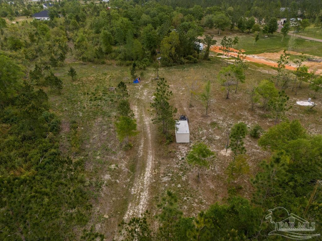 7706 Tidwell Road Pace, FL 32571 - Photo 6 of 25 a view of a lake with houses