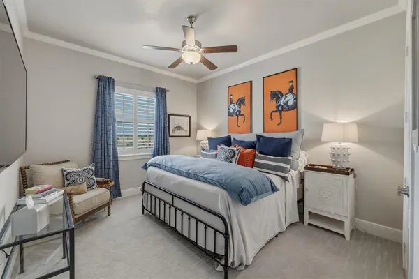 a bedroom with bed and window