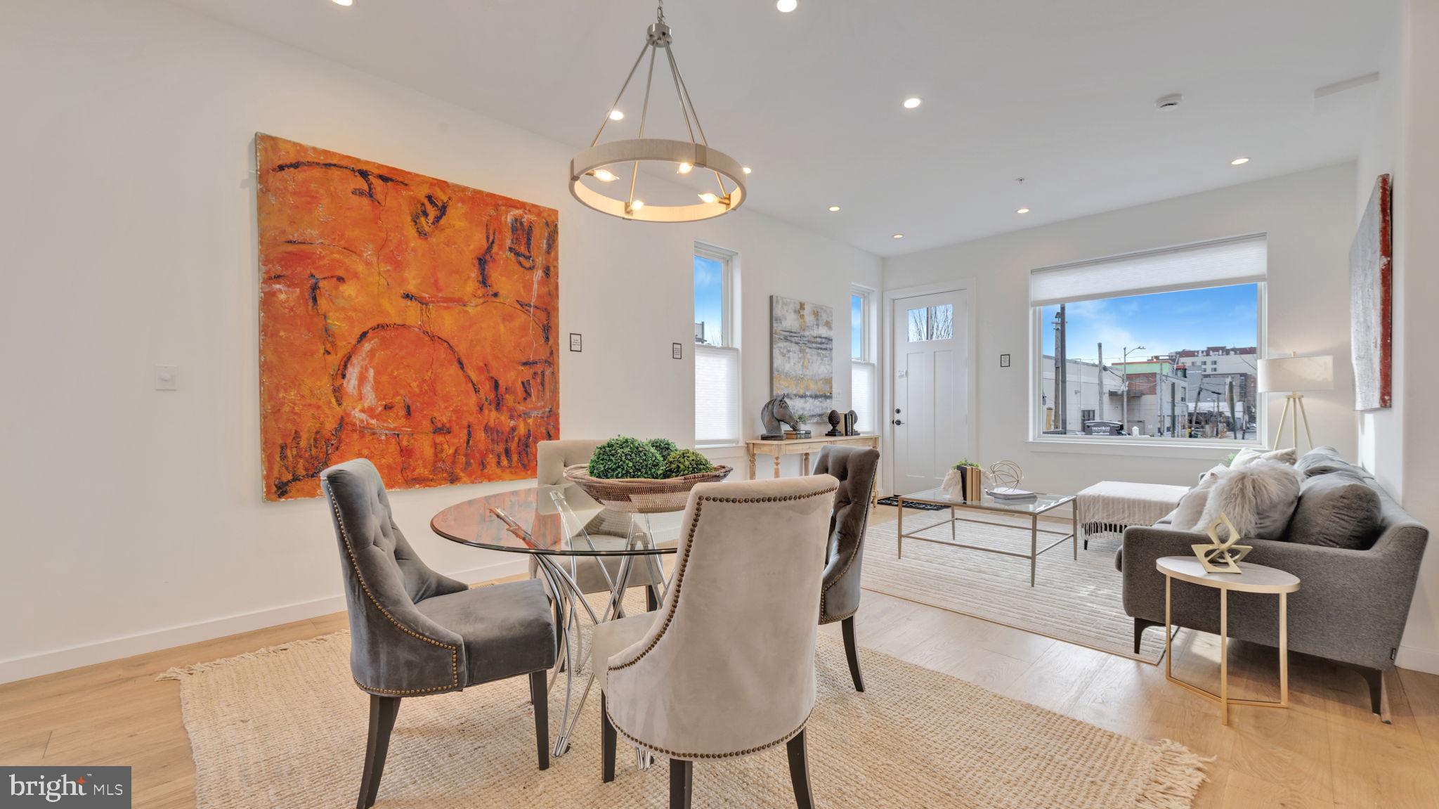 1528 Oates Street Northeast, Unit 1 Washington, DC 20002 - Photo 11 of 54 a view of a dining room with furniture wooden floor and chandelier