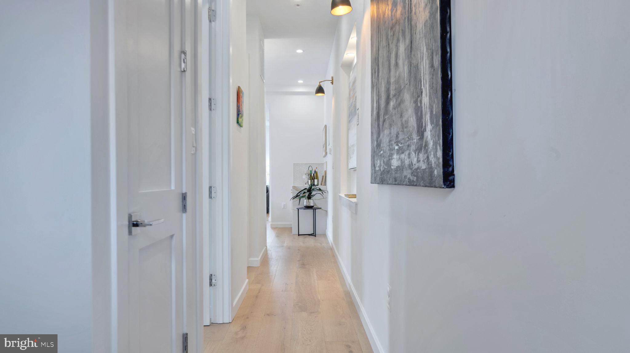 1528 Oates Street Northeast, Unit 1 Washington, DC 20002 - Photo 22 of 54 a view of a hallway with wooden floor