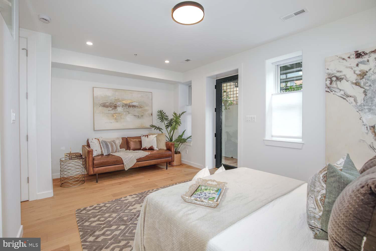 1528 Oates Street Northeast, Unit 1 Washington, DC 20002 - Photo 23 of 54 a living room with furniture and window
