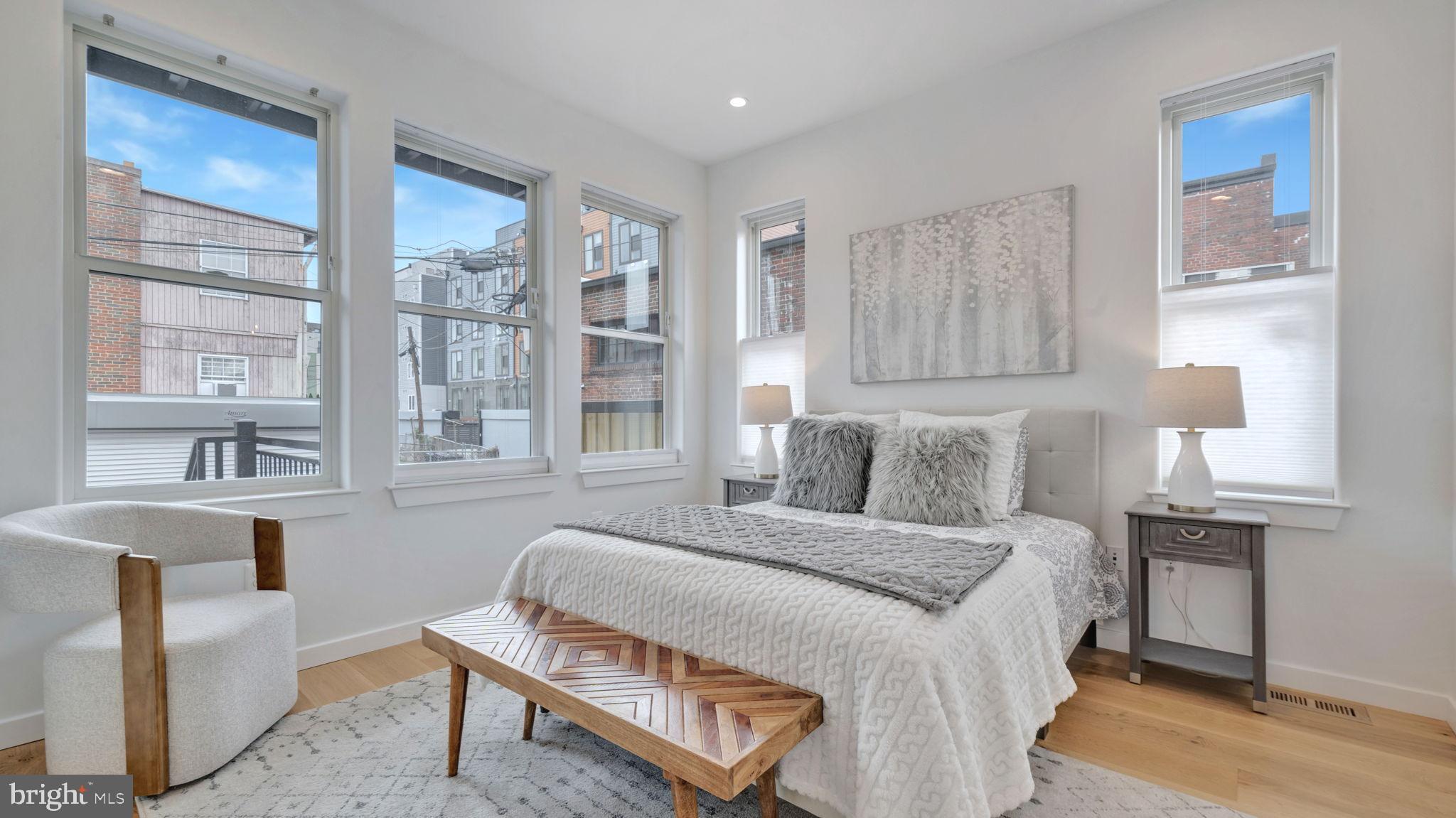 1528 Oates Street Northeast, Unit 1 Washington, DC 20002 - Photo 24 of 54 a bedroom with a bed window and a table