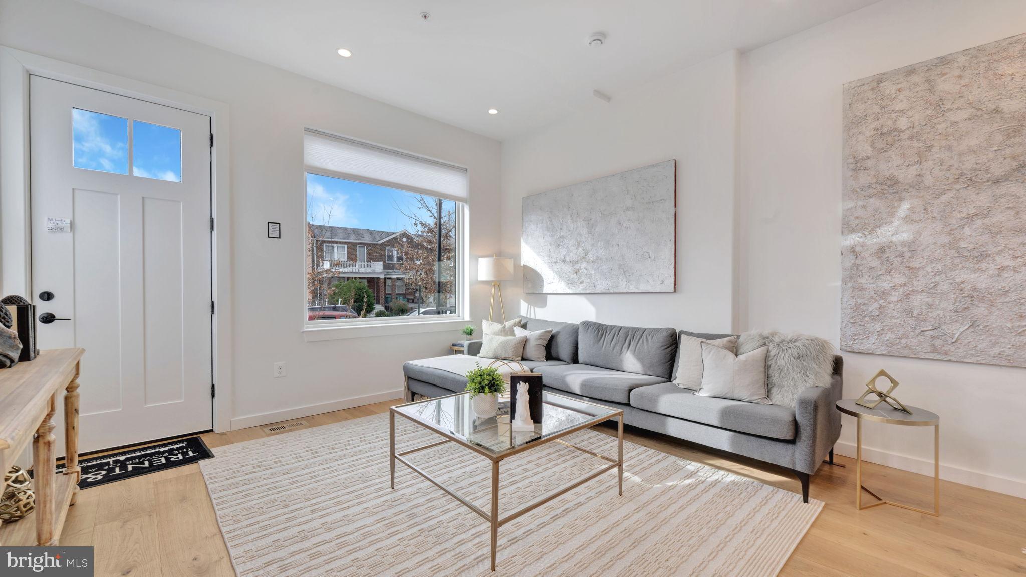 1528 Oates Street Northeast, Unit 1 Washington, DC 20002 - Photo 8 of 54 a living room with furniture and a window