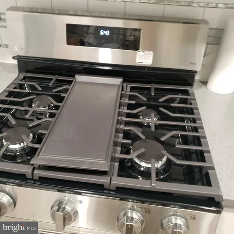 a white toilet sitting next to a shower