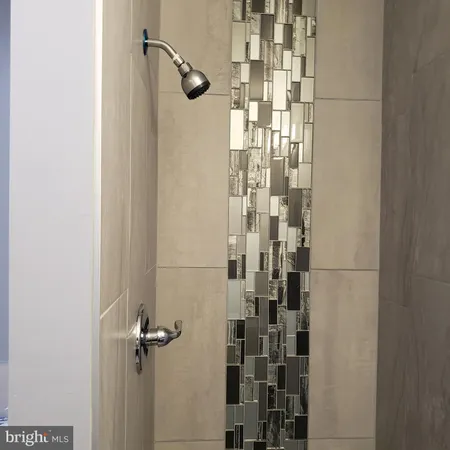 a bathroom with a sink toilet and mirror