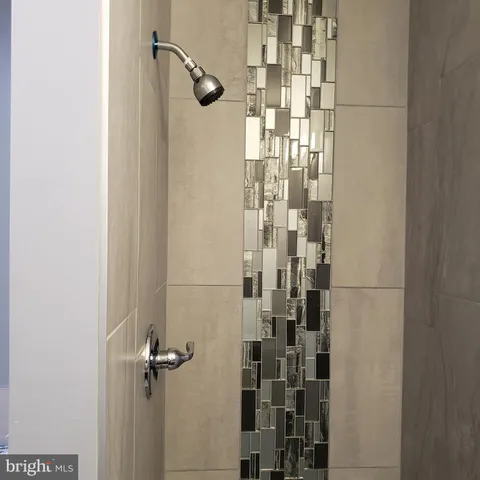 a bathroom with a sink toilet and mirror