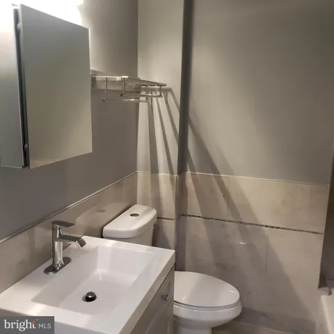 a bathroom with a sink and toilet