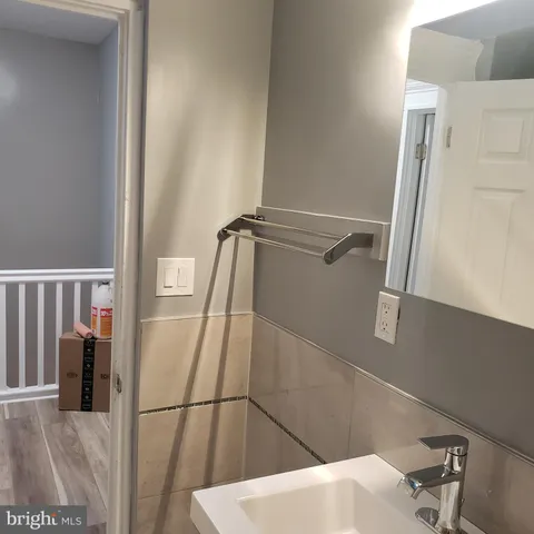 a view of a small space with wooden floor and a window