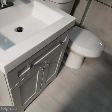 a kitchen with stainless steel appliances a refrigerator a sink a stove a microwave and island