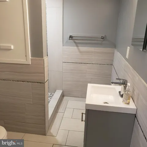 a view of a hallway and wooden floor