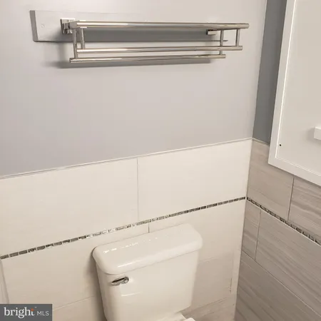 a front view of a house with parking space