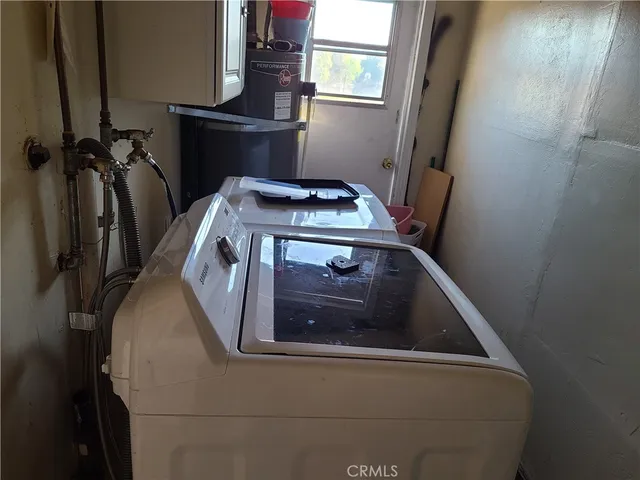 a view of a hallway with paintings on the wall