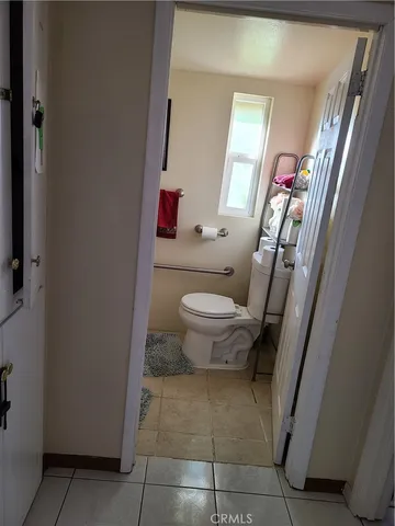 a view of a house with wooden fence