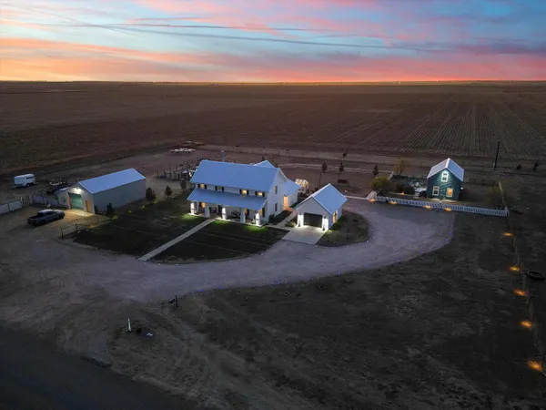 an aerial view of a house with roof deck