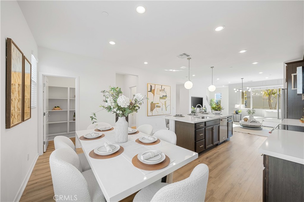 108 Citysquare Irvine, CA 92614 - Photo 15 of 45 a dining room with furniture and wooden floor