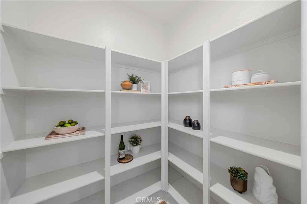 108 Citysquare Irvine, CA 92614 - Photo 18 of 45 a view of walk in closet with clothes and shoes