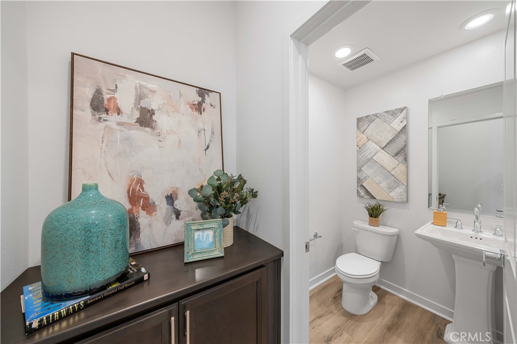 108 Citysquare Irvine, CA 92614 - Photo 19 of 45 a bathroom with a toilet sink and mirror